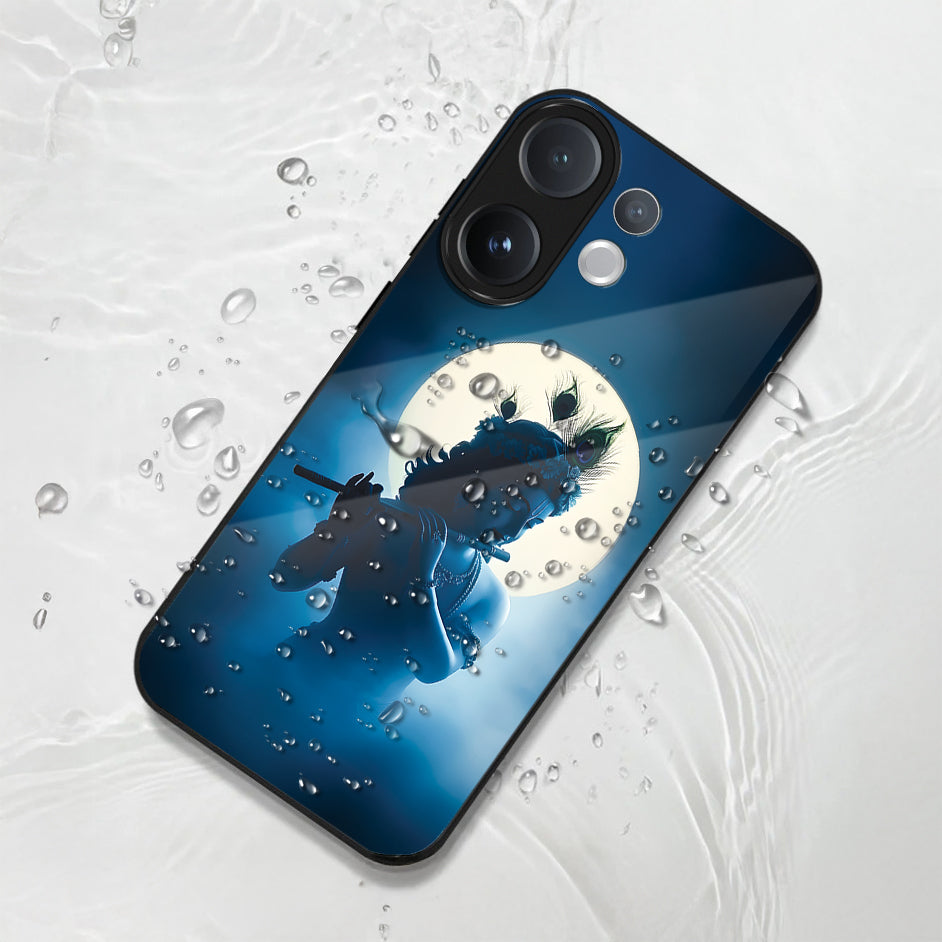 Phone case with a design of a krishna and moon on a blue background, placed on a textured white surface.
